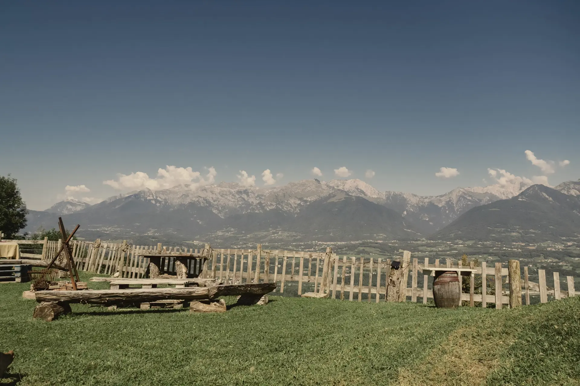 swiss meadows and mountains with a camper van in the middle